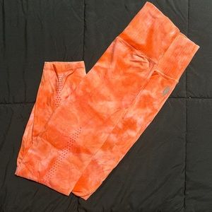 Orange tie dye perforated back legs free people leggings